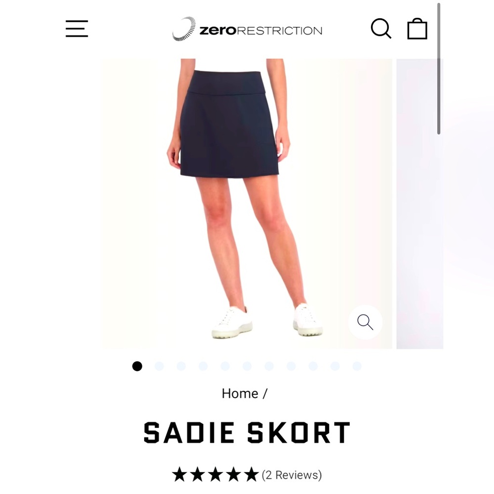 Great condition Zero Restriction Golf Skort. Black, size M, 17” length.
